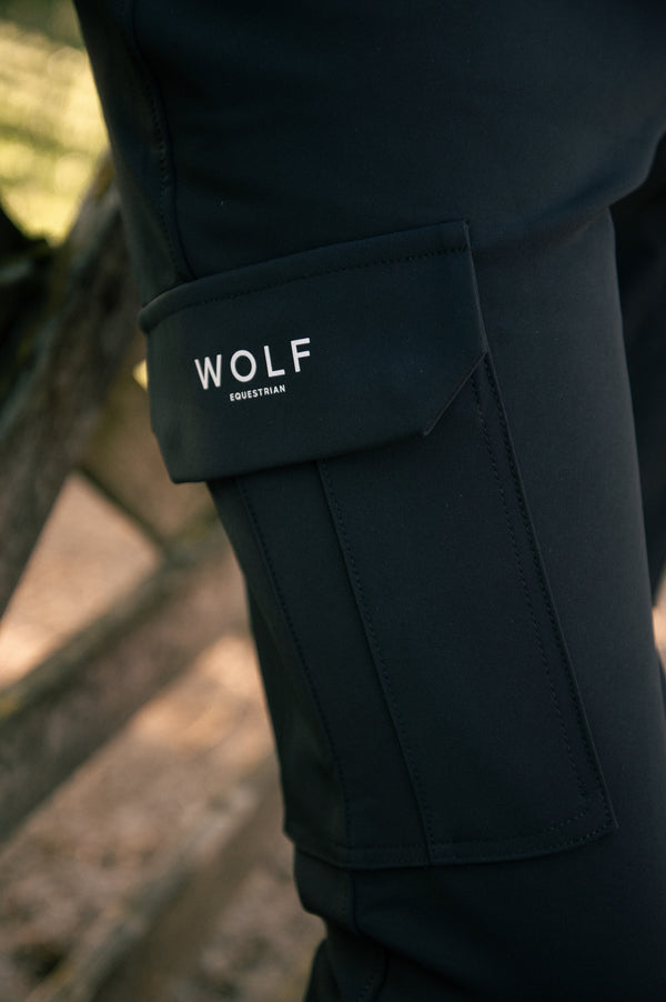 Close up of cargo pocket on the men's black breeches
