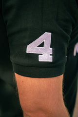 Side view of black polo shirt 