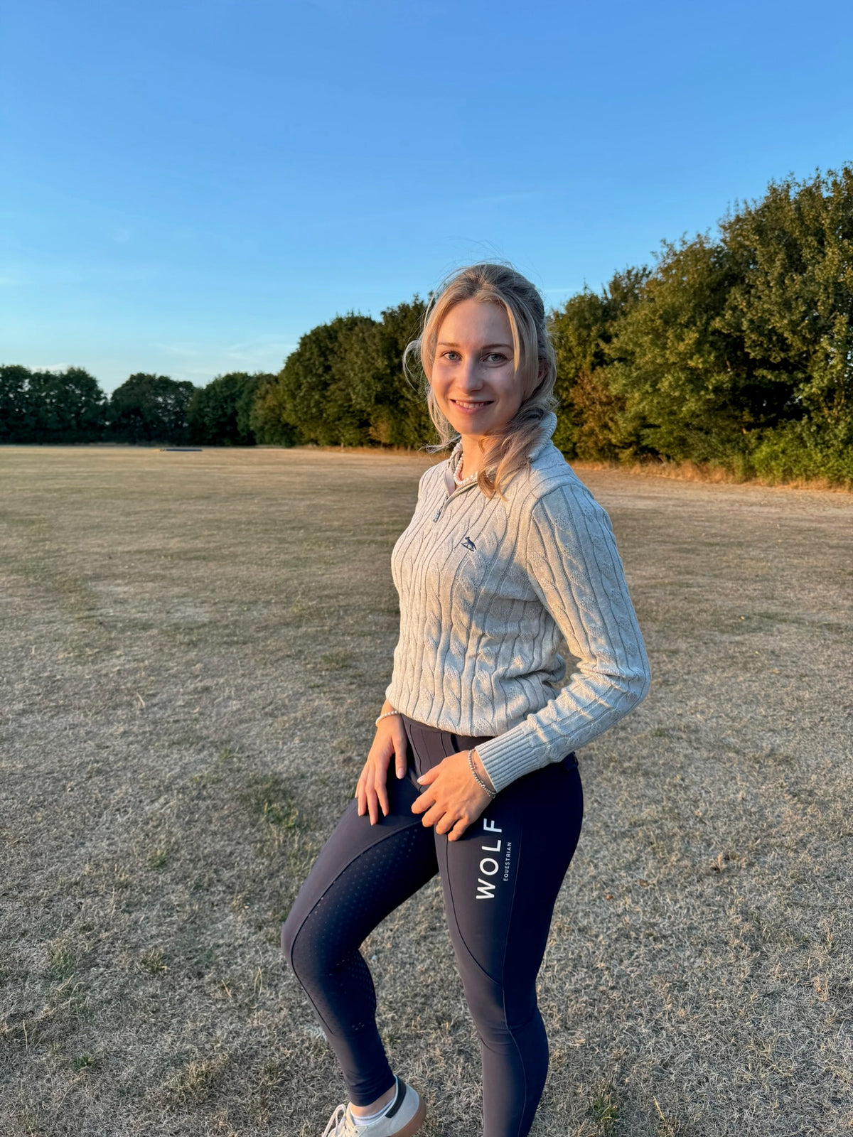 Women's Grey Cable knit Jumper Side View with Navy Wolf Logo