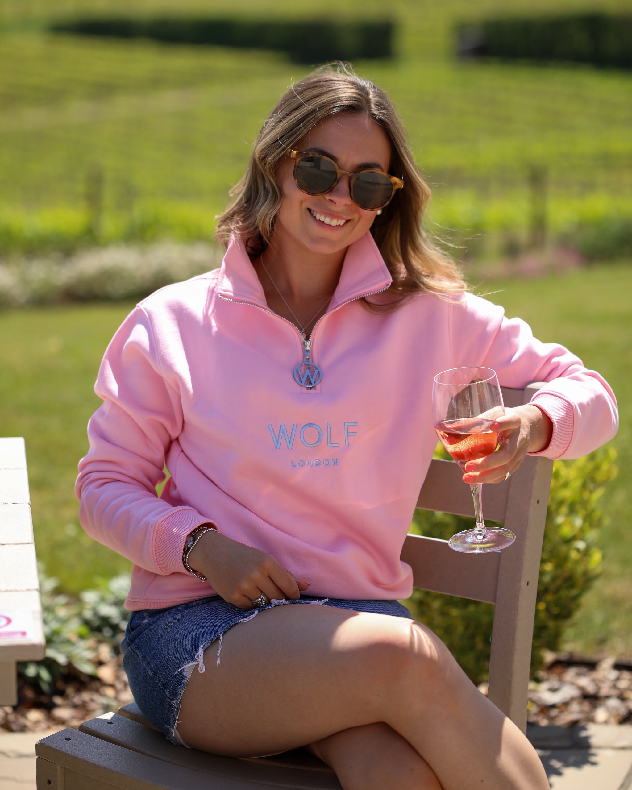 Women's pink quarter zip front view